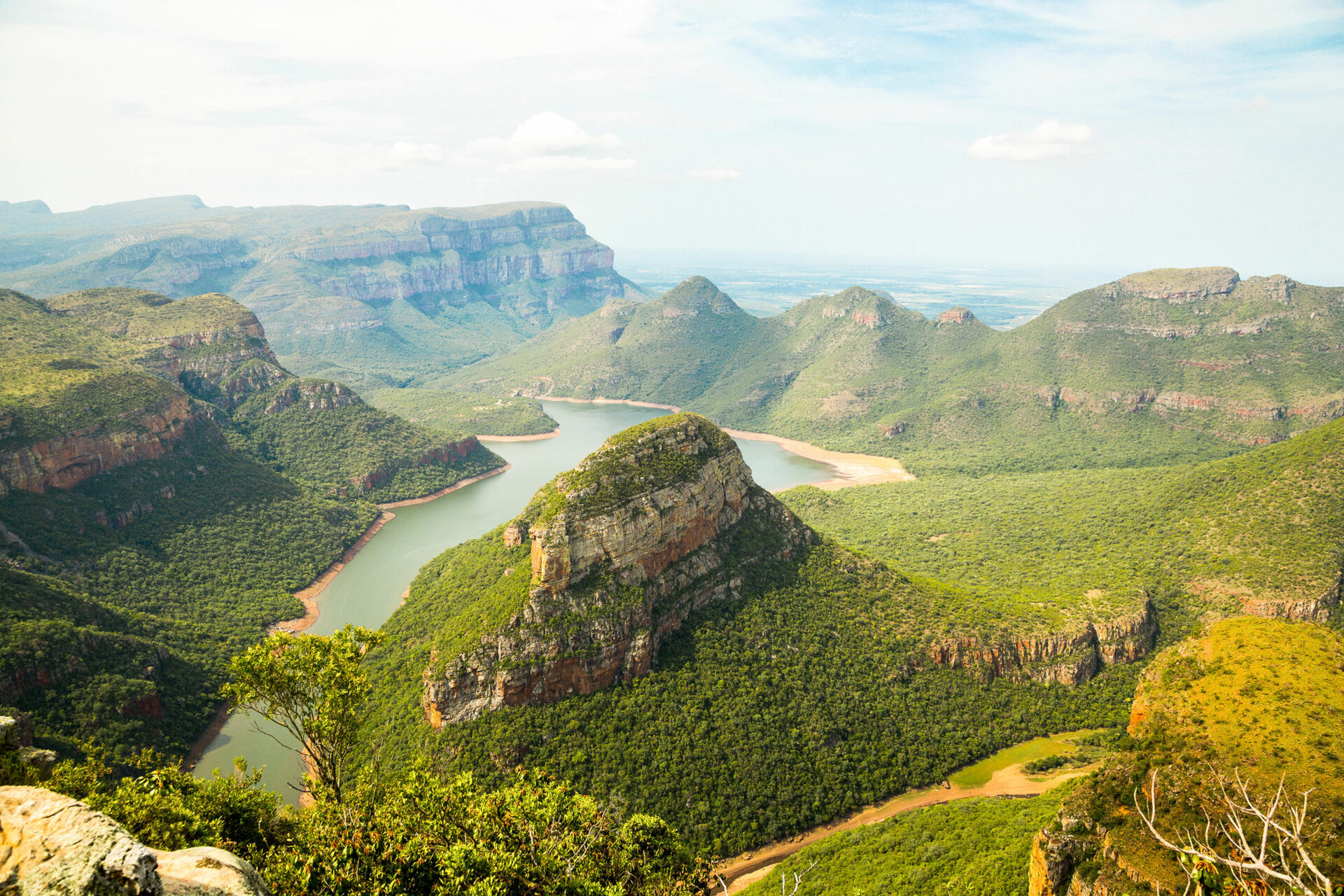 small hill formations with a large lake in the middle
